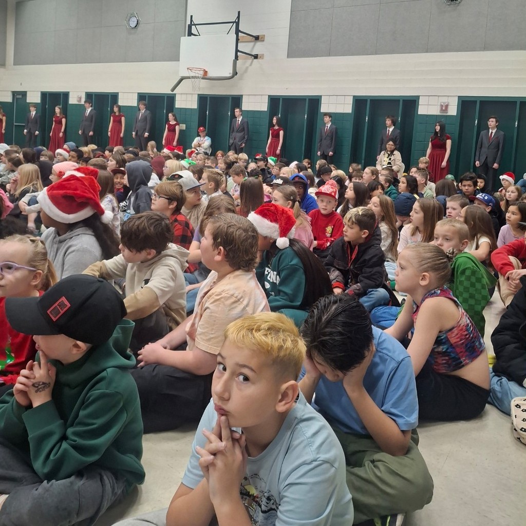 Weber High Chamber Choir performing for students 