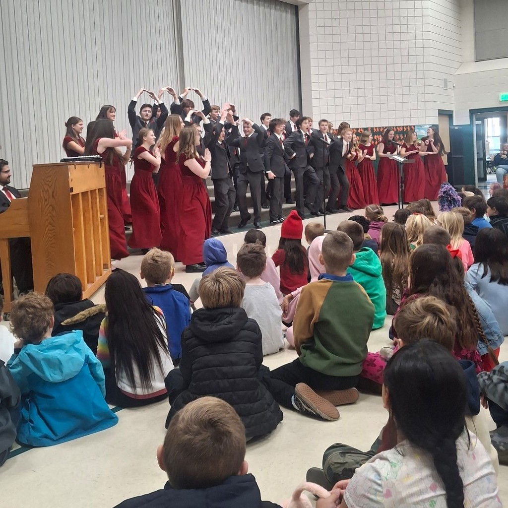 Weber High School Chamber Choir performing for students