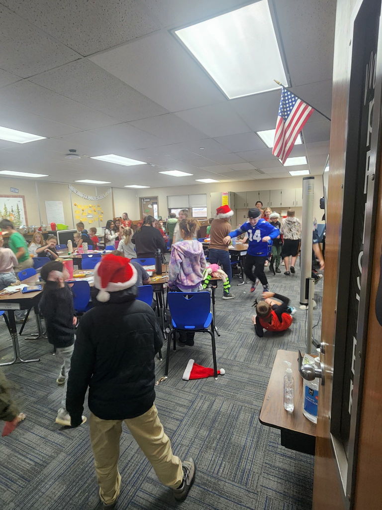 5th and 2nd graders throwing snowballs in a classroom.