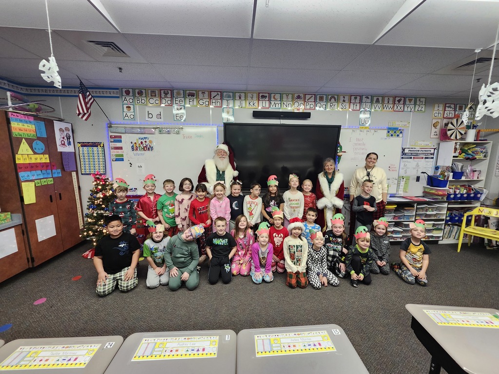 1st Grade Mrs. Jones Class posing with Santa Claus
