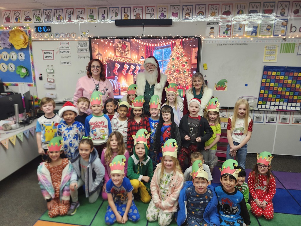 1st Grade posing with Santa Claus