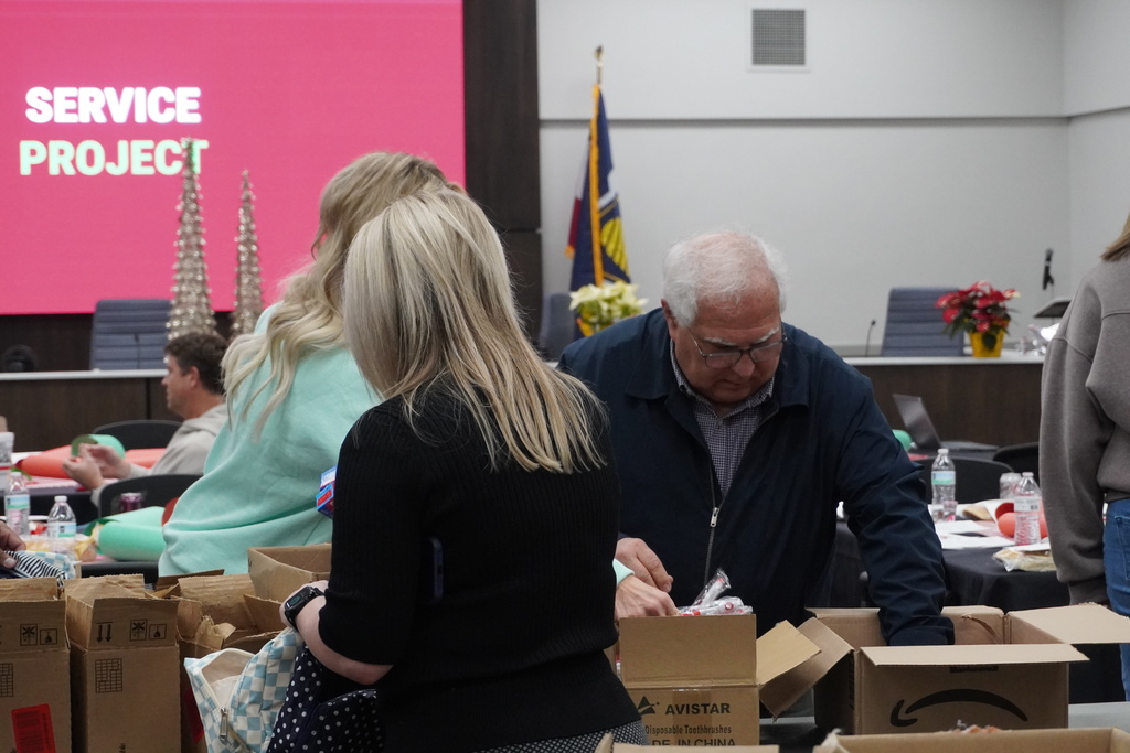 Board members came together to assemble hygiene kits that will be available at teen centers for students in need.