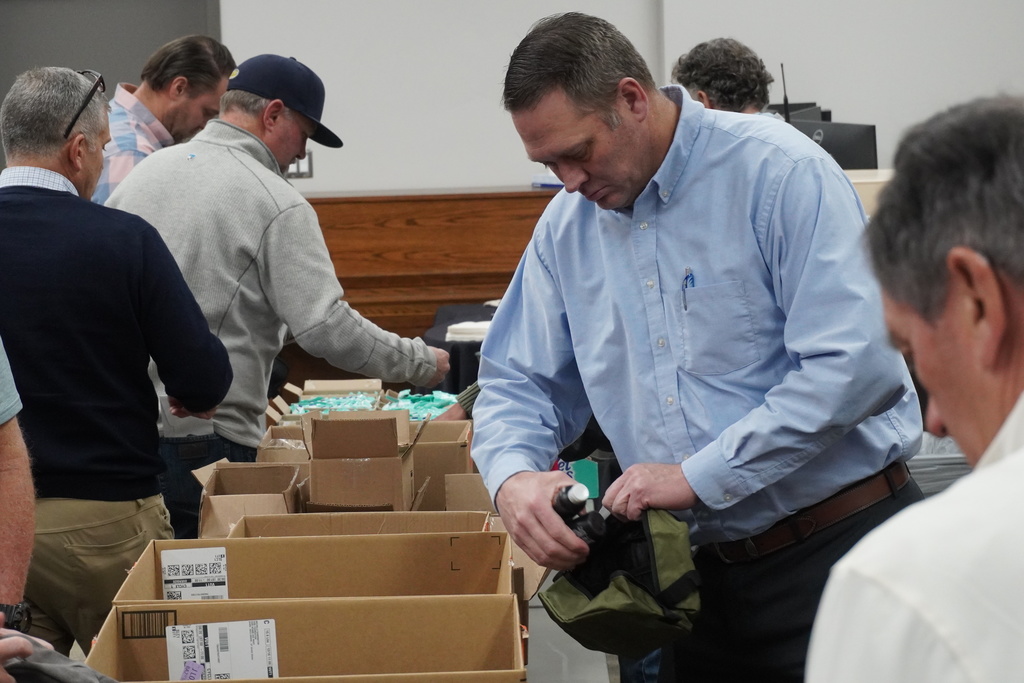 Board members came together to assemble hygiene kits that will be available at teen centers for students in need.