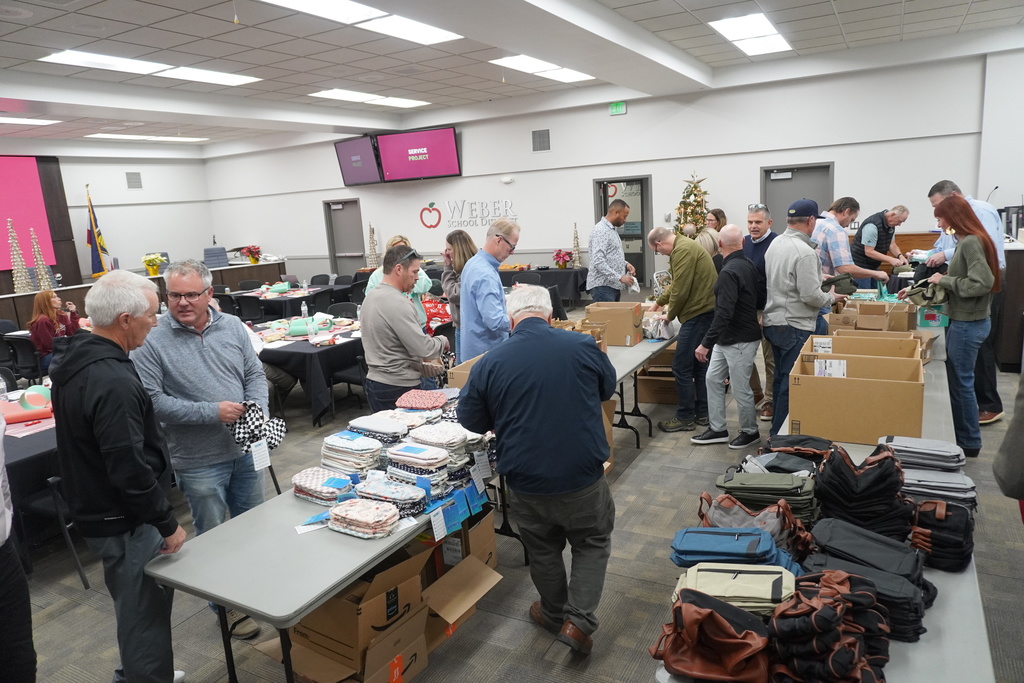 Board members came together to assemble hygiene kits that will be available at teen centers for students in need.