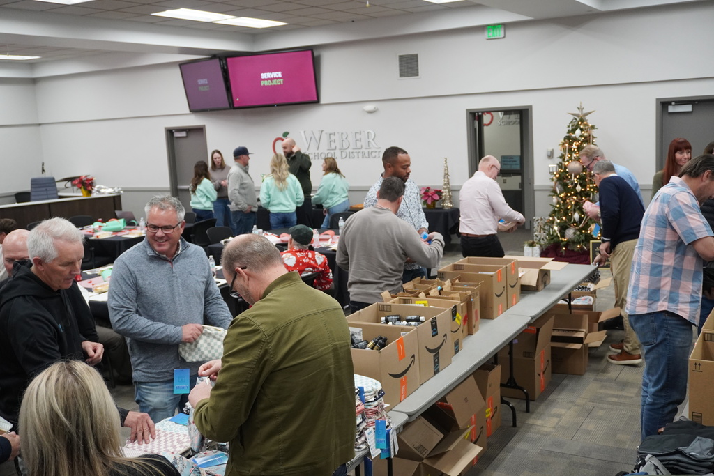 Board members came together to assemble hygiene kits that will be available at teen centers for students in need.