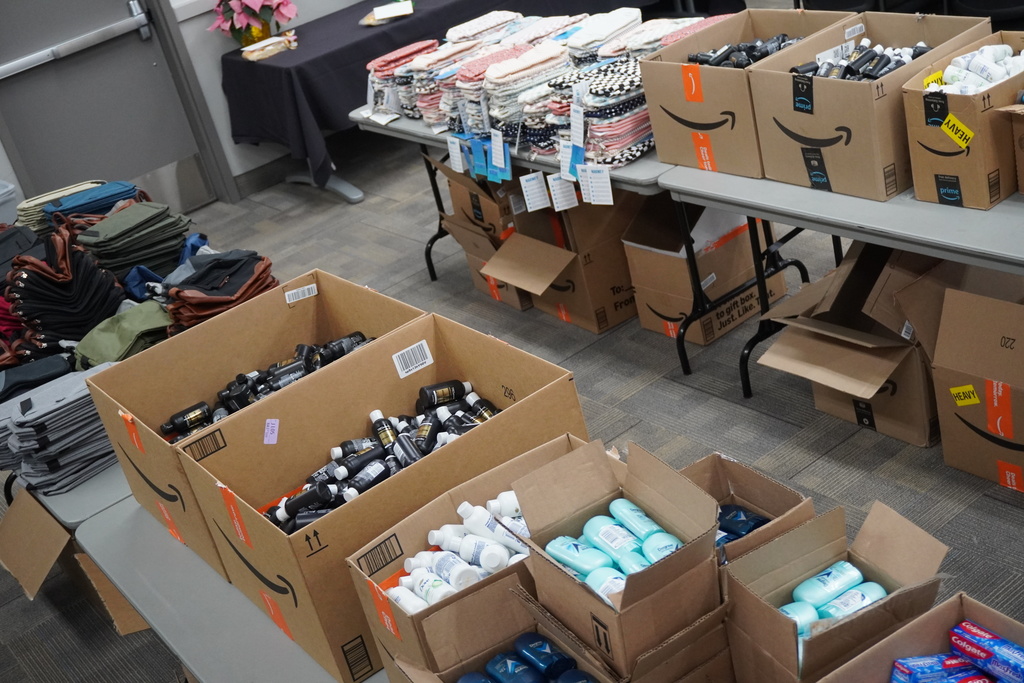 Board members came together to assemble hygiene kits that will be available at teen centers for students in need.