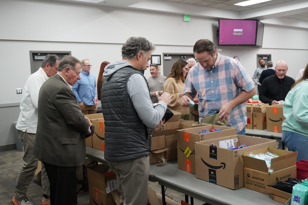 Board members came together to assemble hygiene kits that will be available at teen centers for students in need.