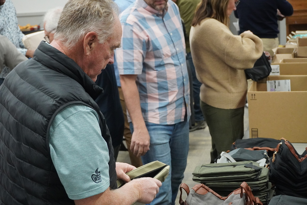 Board members came together to assemble hygiene kits that will be available at teen centers for students in need.