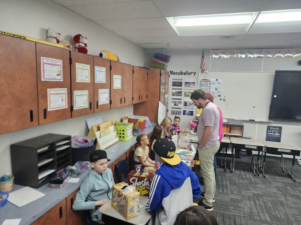 3rd Grade Market Day, kids were buying and selling treats and toys and games with their class money