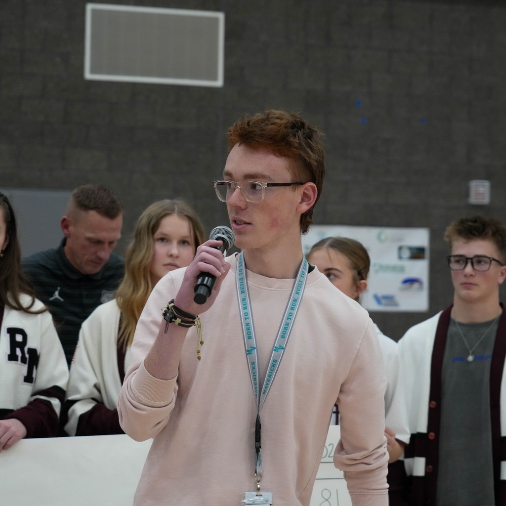 Christmas box house student donations half time presentation presenter.