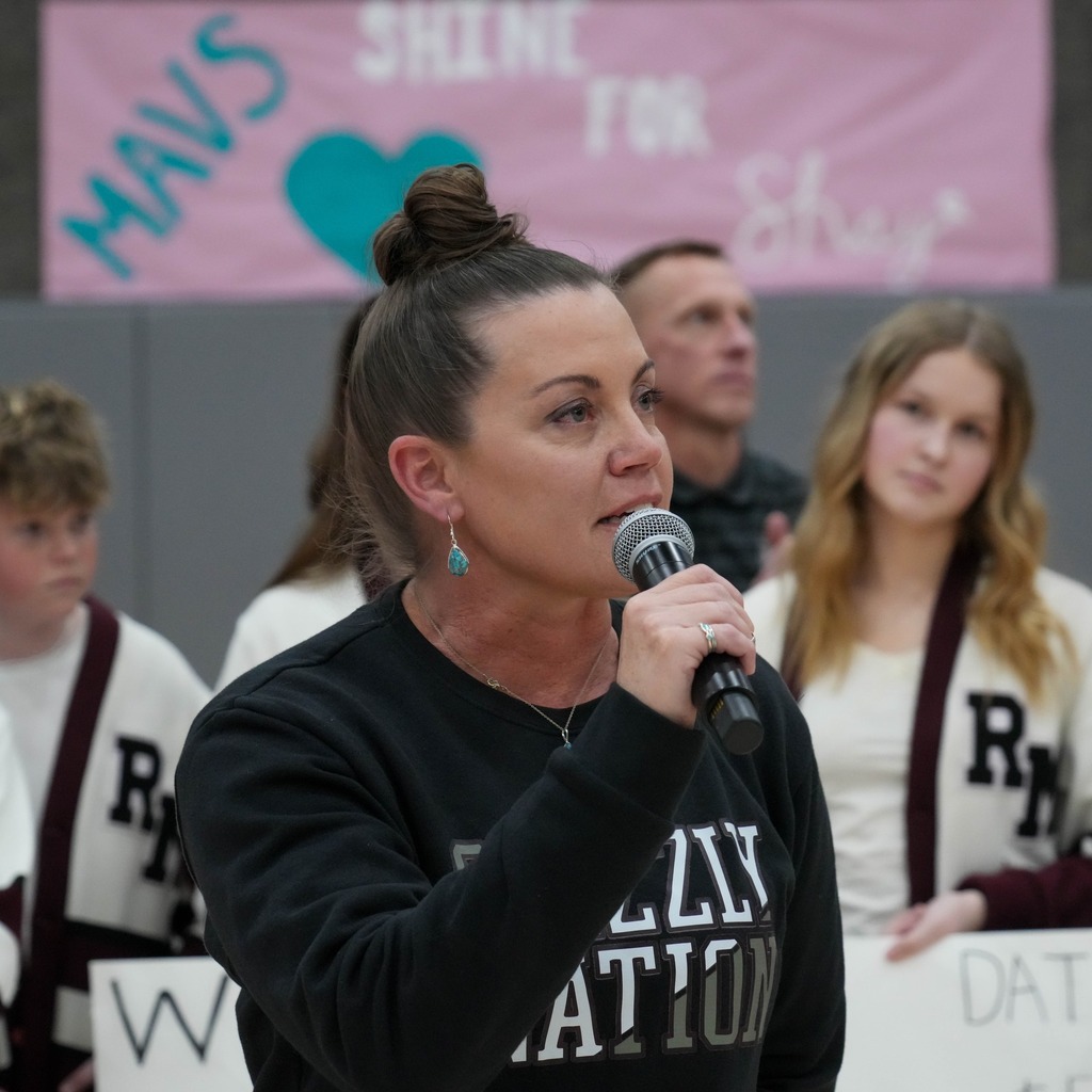 Christmas box house student donations half time presentation presenter.