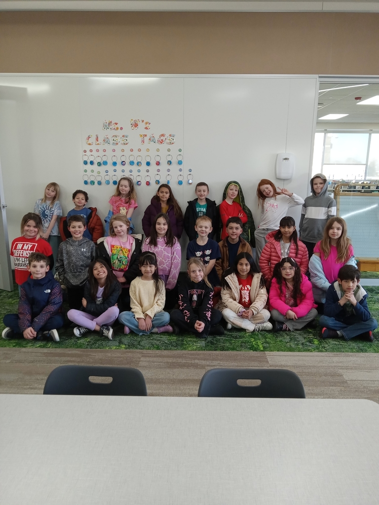 Ms. W's class standing in front of their brag tags.