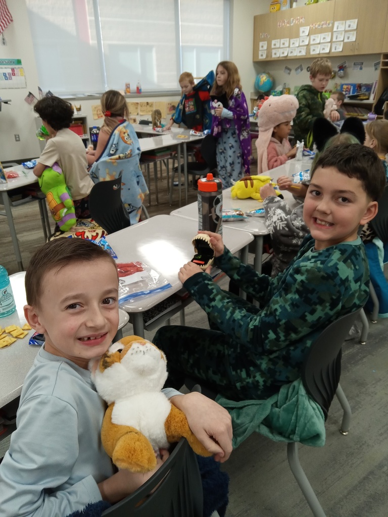 3rd grade students showing the toys that they brought for their incentive party.