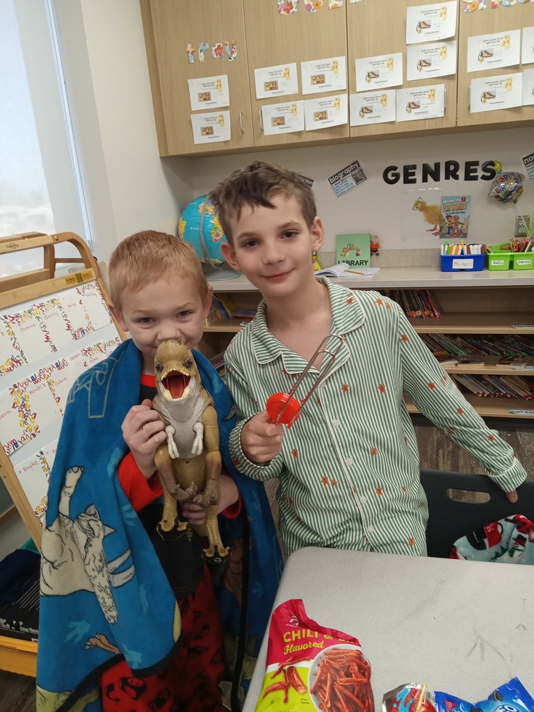 3rd grade students showing the toys that they brought for their incentive party.