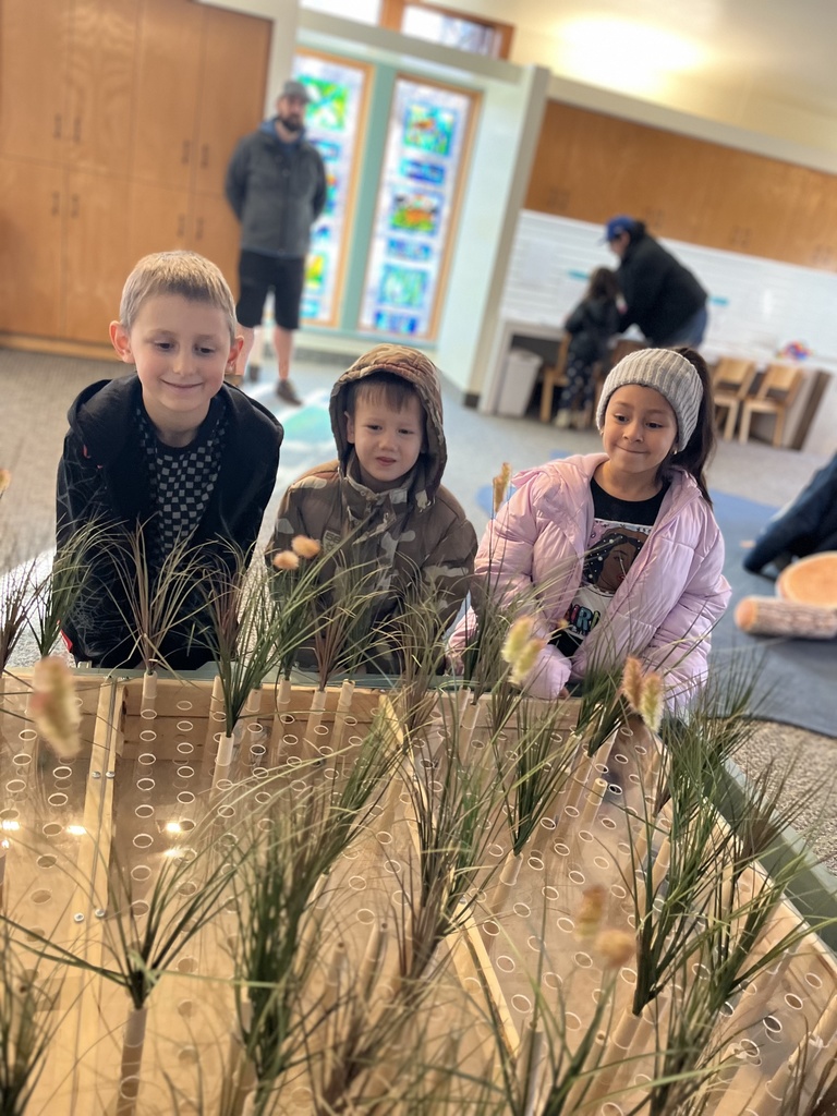 first grade students exploring how reeds effect how water moves