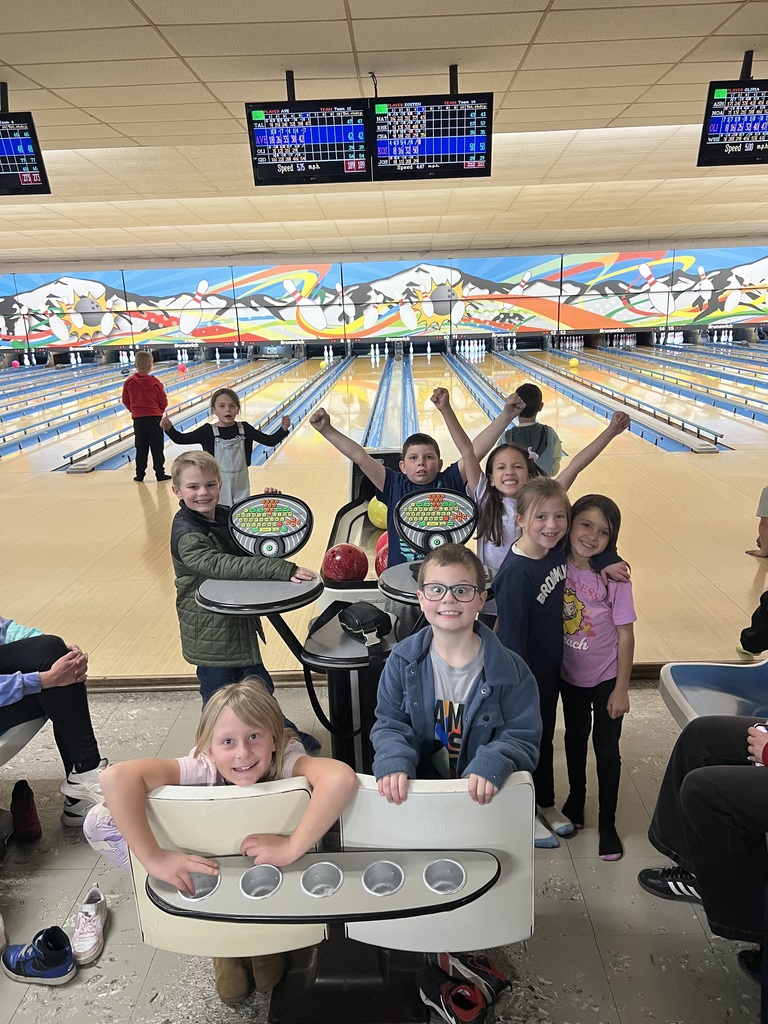 Student smiling at the bowling alley.