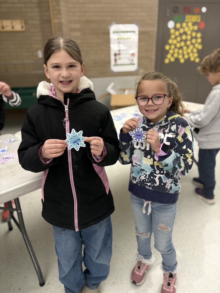 student holding a snowflake