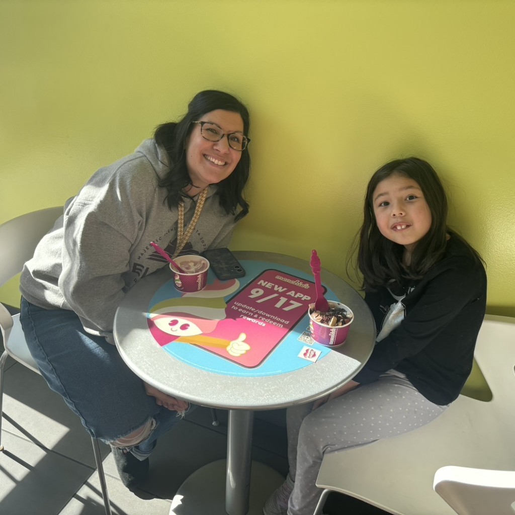 A girl enjoying icecream with Mrs. Wilcox