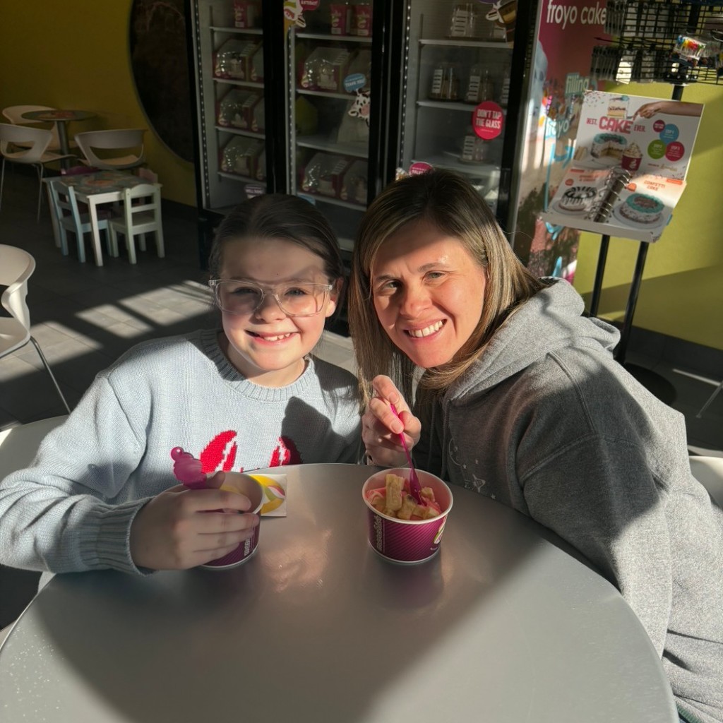 A girl and her mom enjoying icecream at Menchies 