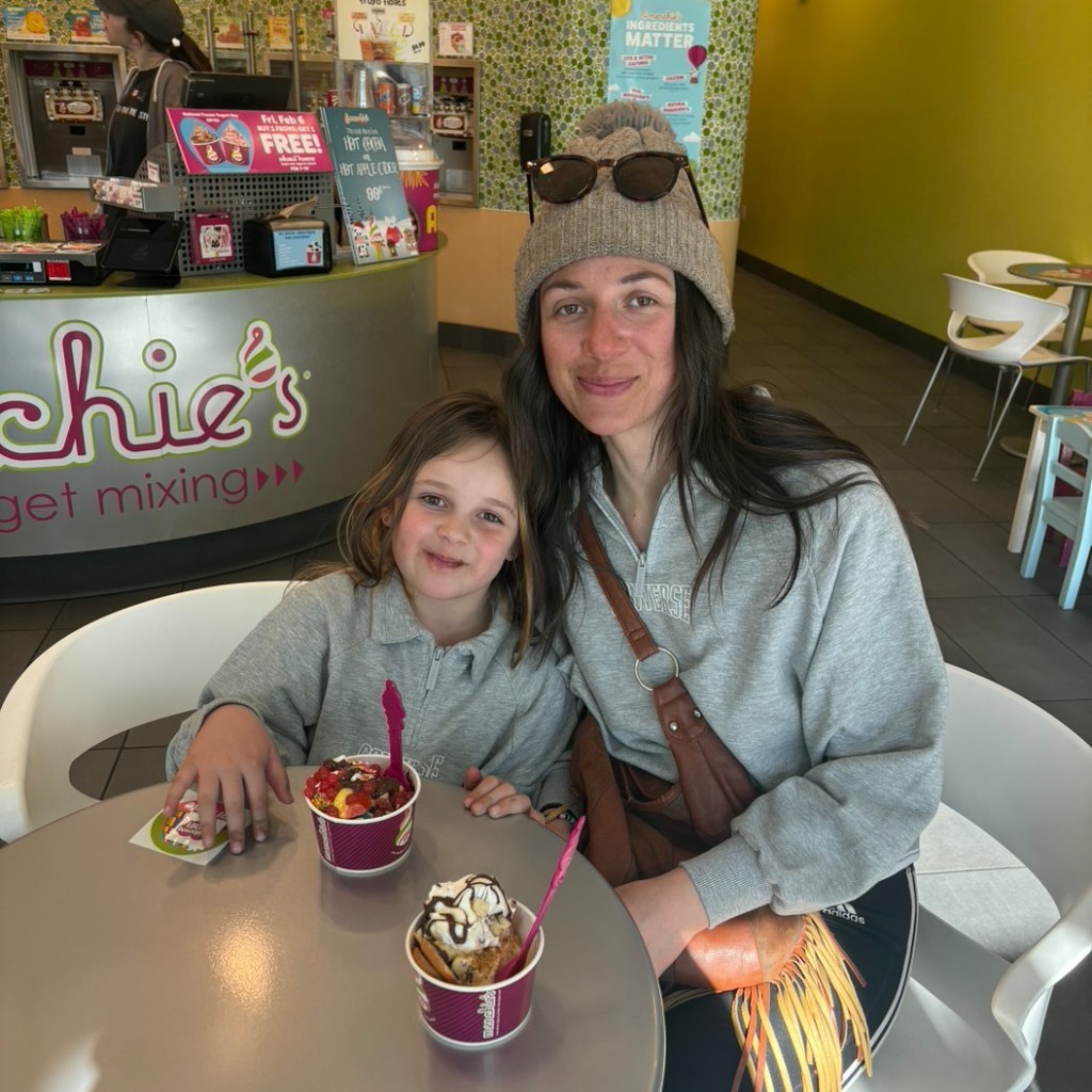 A girl and her mom eating icecream at Menchies 