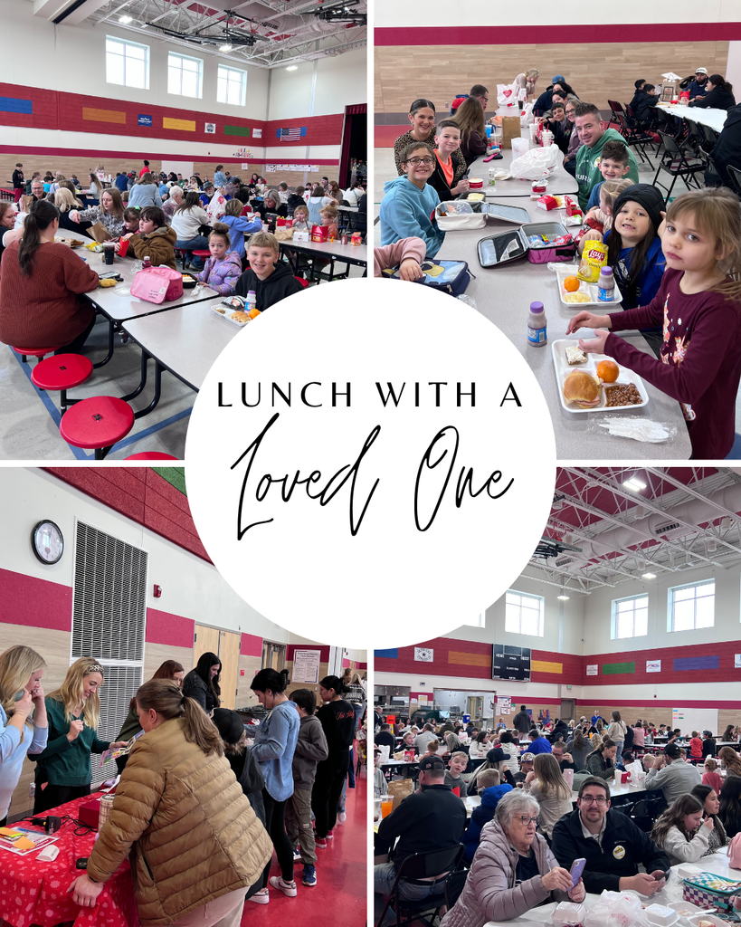 A four-panel photo collage centered around a white circle with text that reads "LUNCH WITH A Loved One."  The surrounding photos show elementary school students smiling and sitting at cafeteria tables with visiting adults.