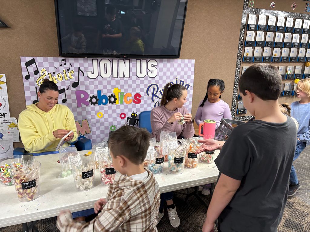 Students choosing their favorite sucker flavor.