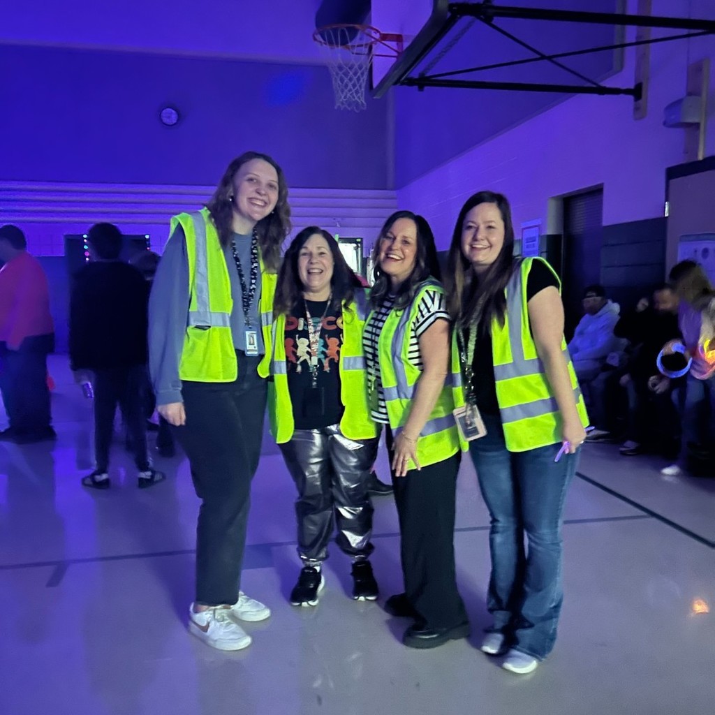 some teachers dressed in neon vests