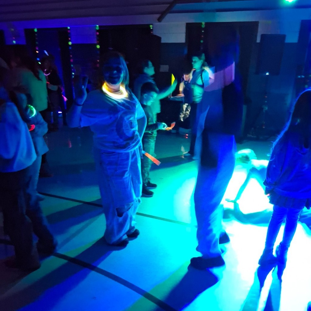 Kids with glowsticks at the dance