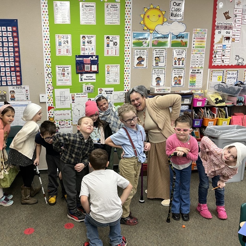 Mrs. Stoker's class posing and dressed like old people.