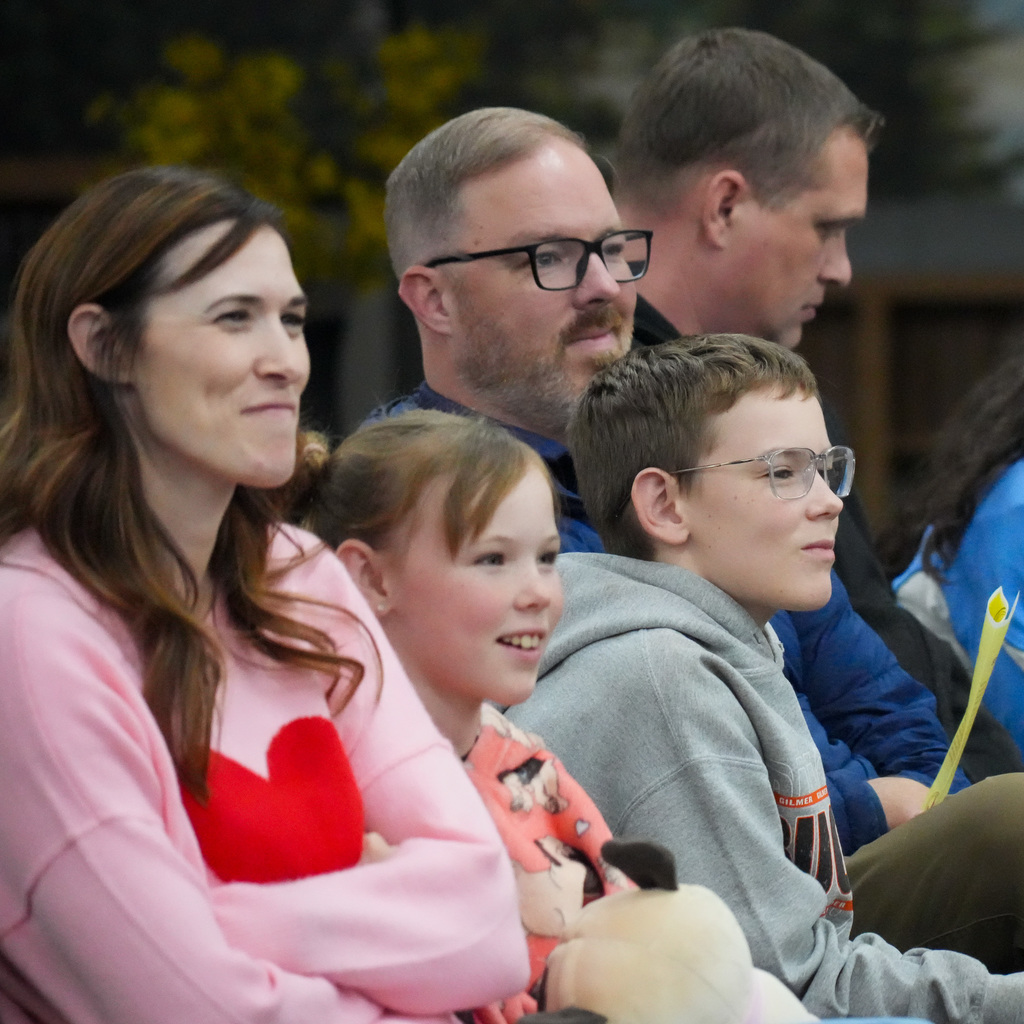 Students telling stories at a microphone.