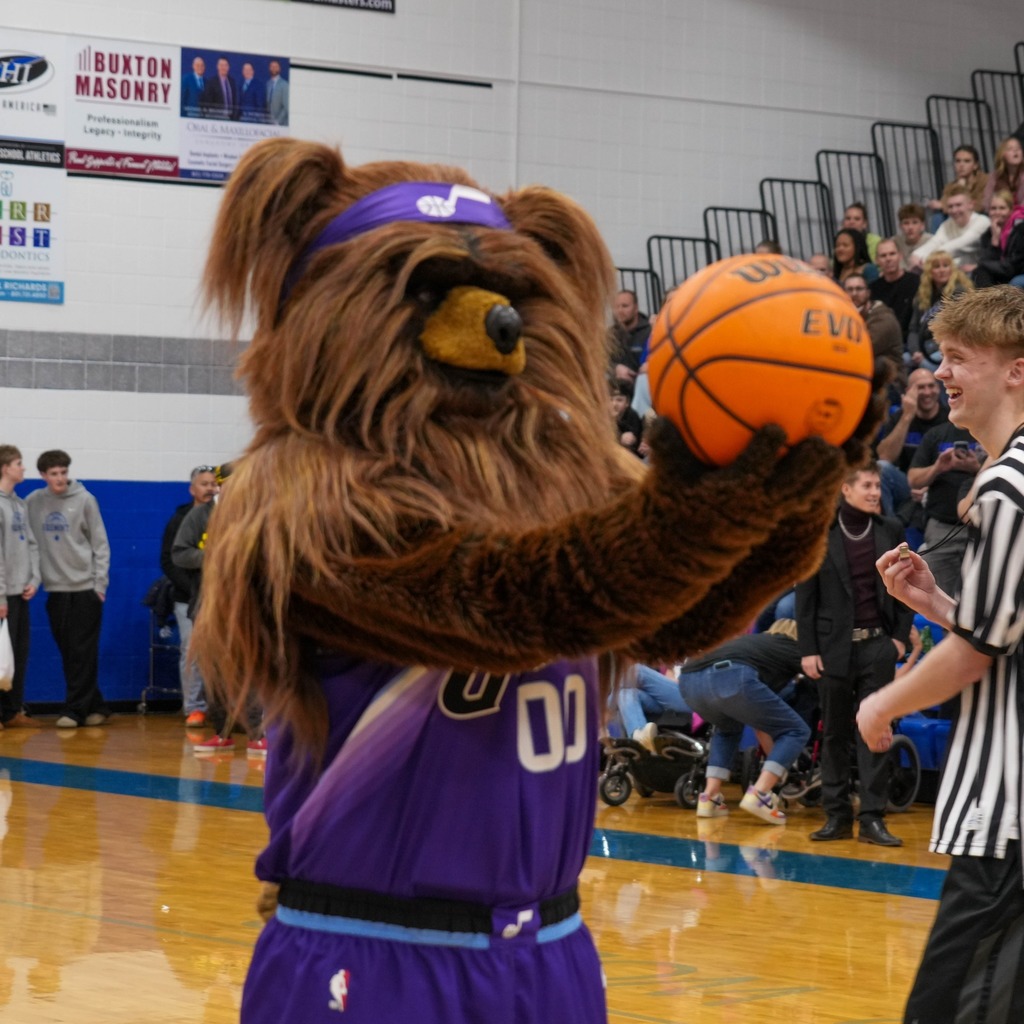 Unified basketball players with Jazz bear
