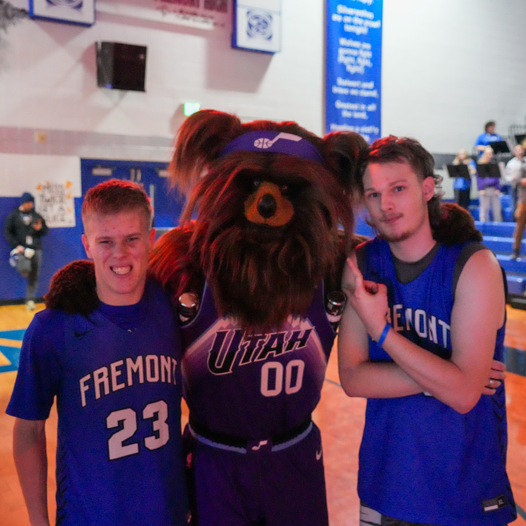 Unified basketball players with Jazz bear