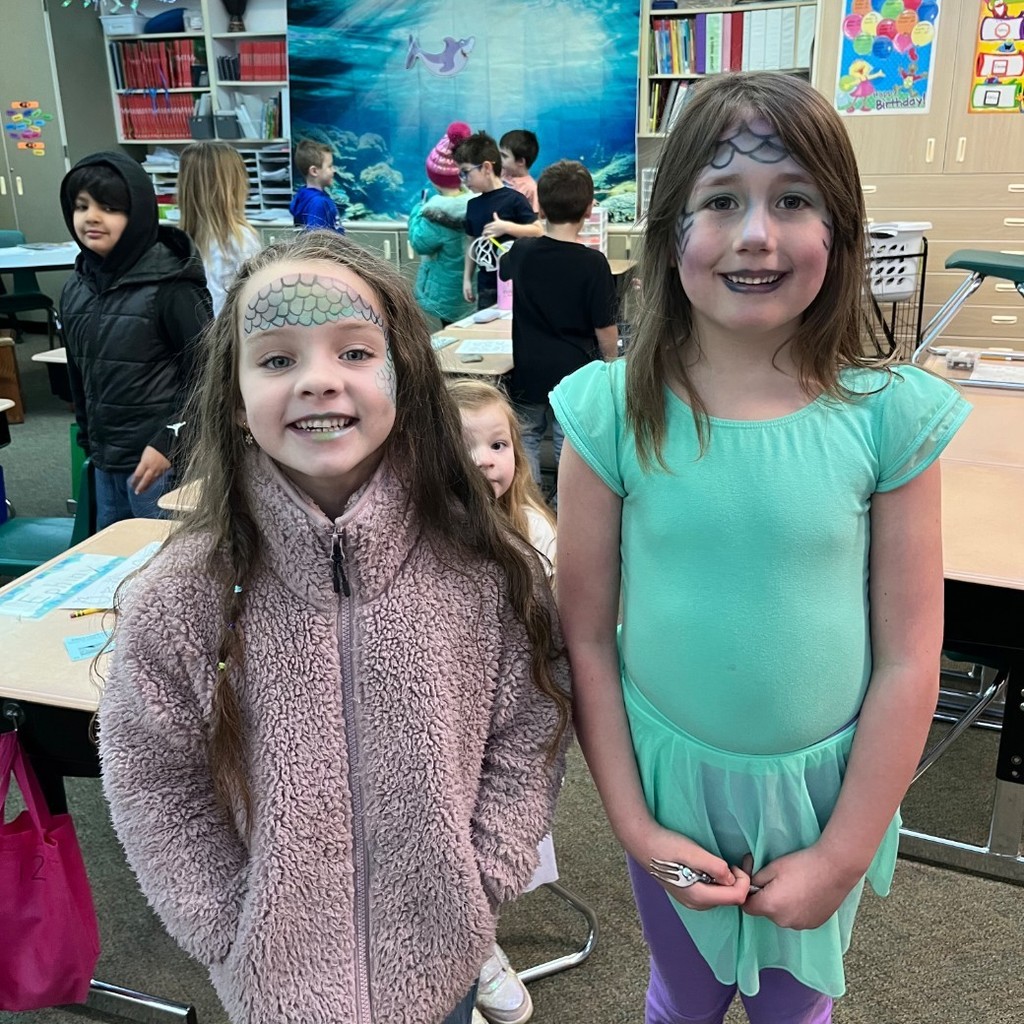 girls ith ocean like face paint