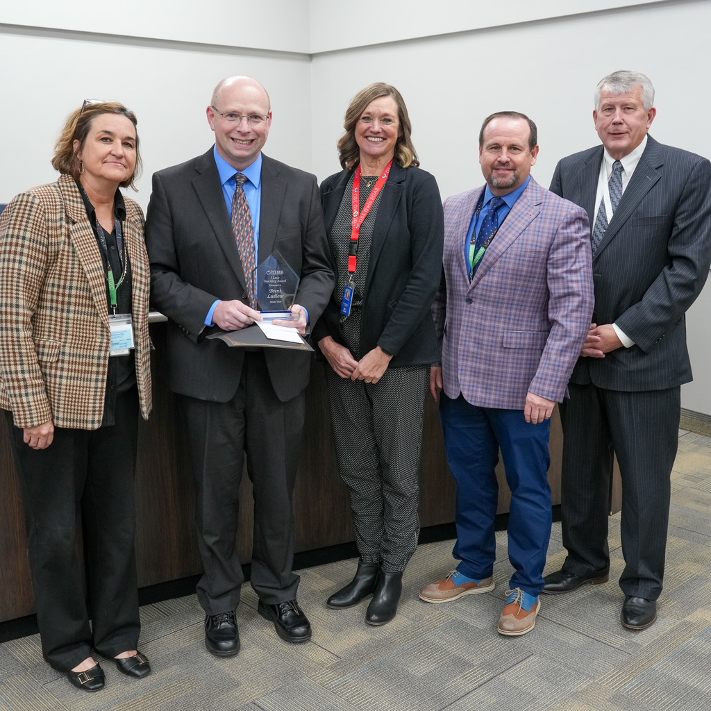 Brent Ludlow receiving award.