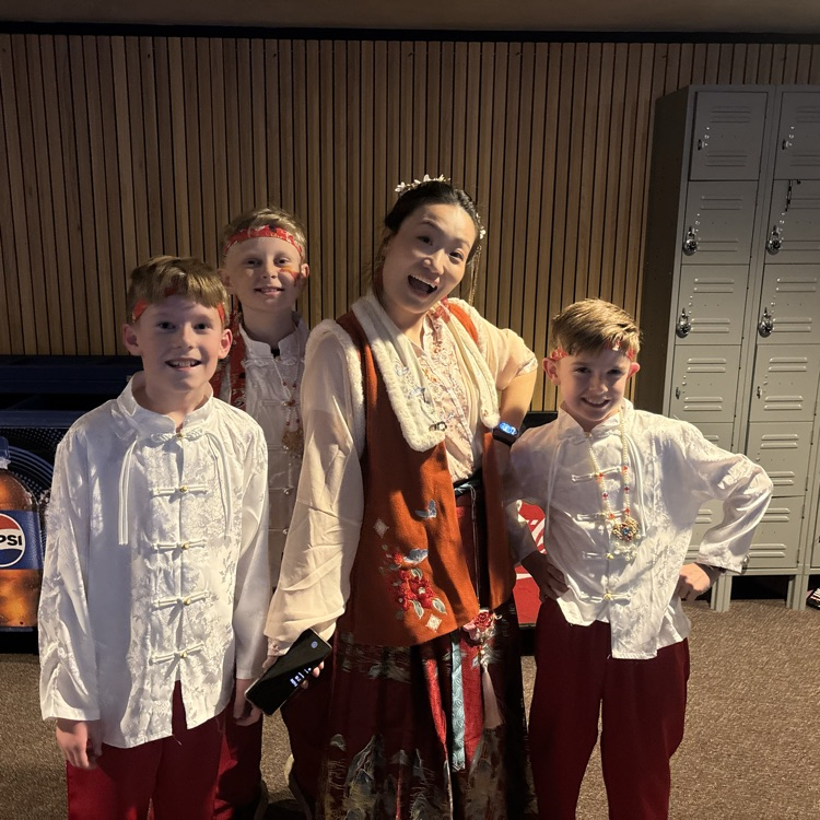 5th grade students posing with Ms. Peng at The Chinese New Year program  
