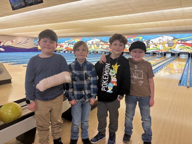 students smiling at the bowling alley