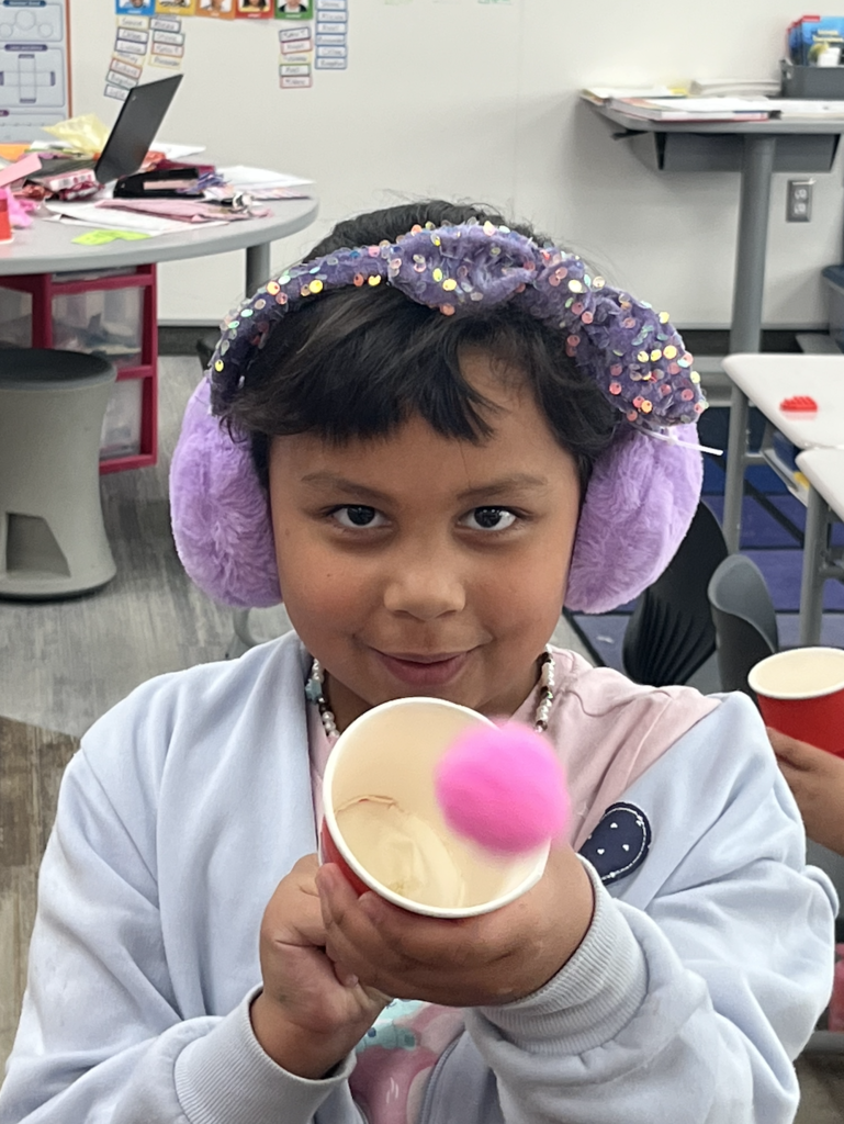 student with a valentines day popper