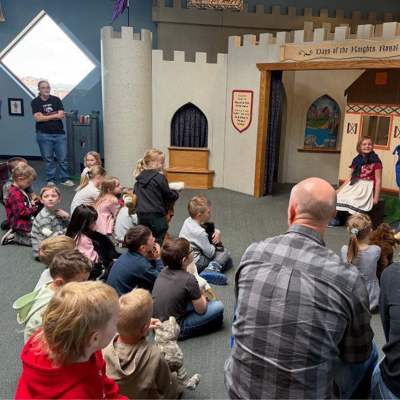 1st Grade Spotlight- students listening to presenter at Treehouse Museum