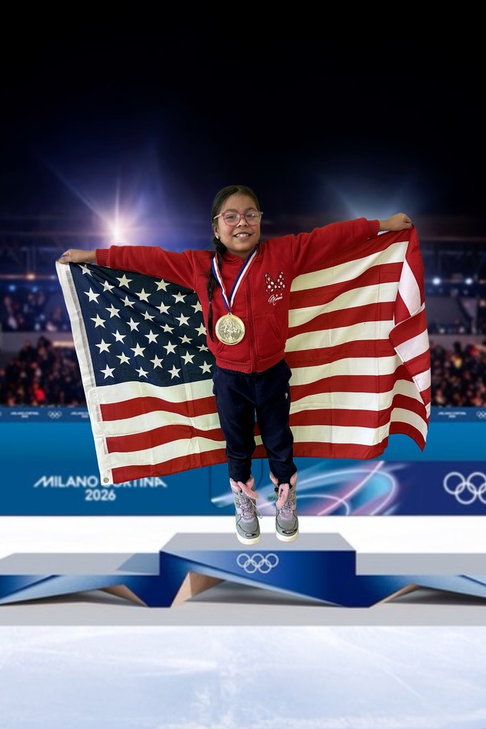 first grade student standing on an olympic podium wearing a gold medal and holding the USA Flag