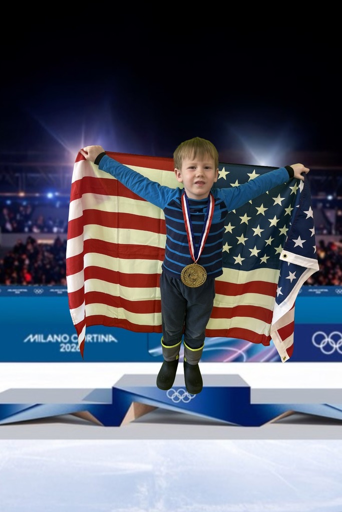 first grade student standing on an olympic podium wearing a gold medal and holding the USA Flag