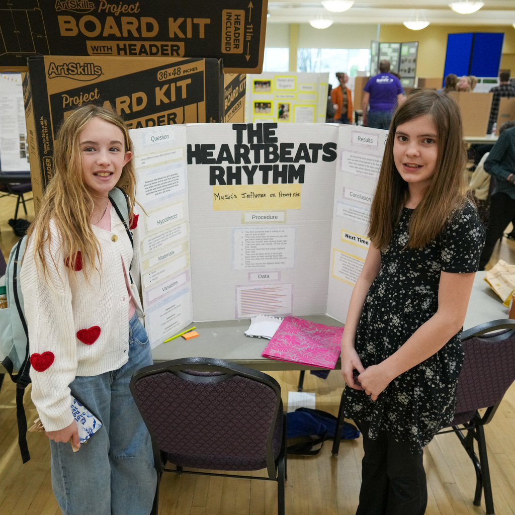 Stem Fair students standing with their projects.