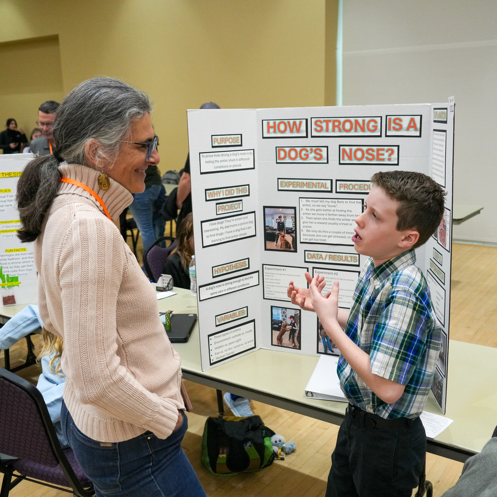 Stem Fair students standing with their projects.