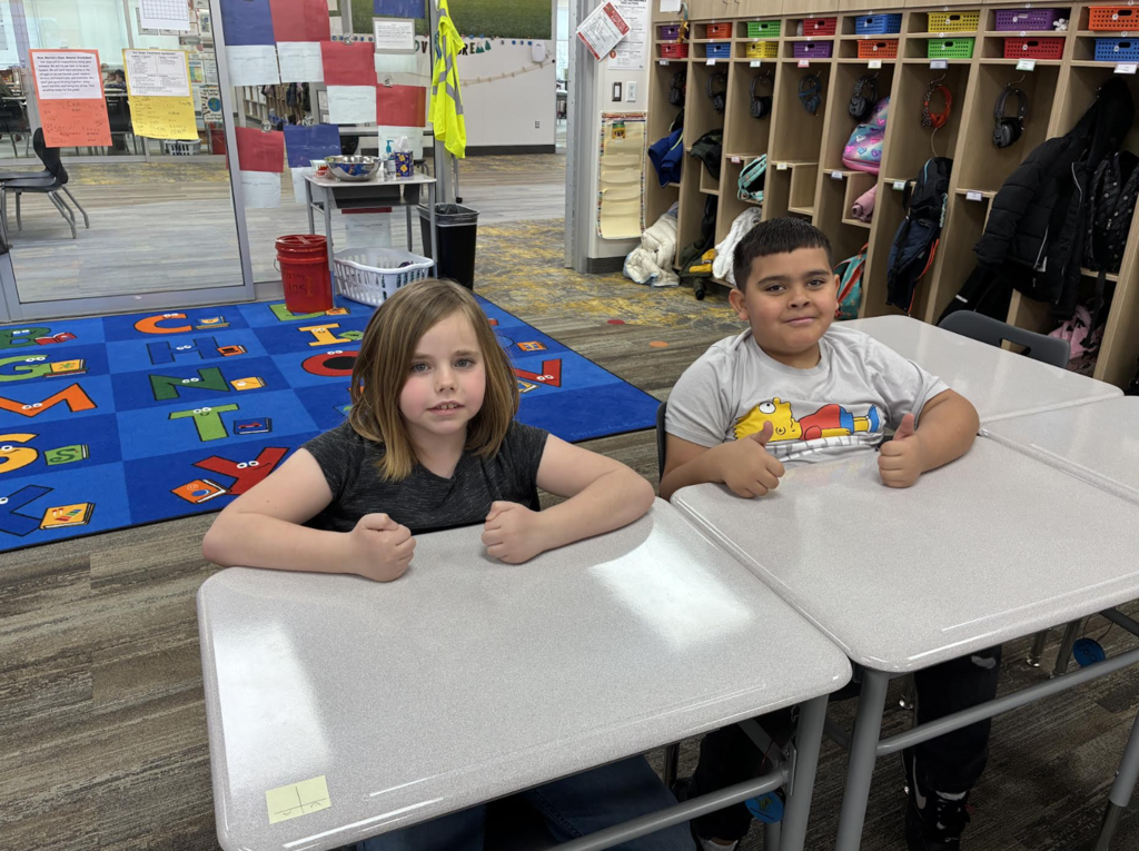 students showing the actions that go along with vocabulary words