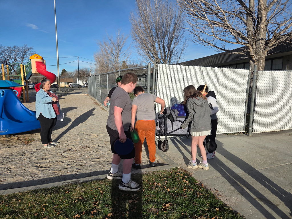Students carrying the wagon