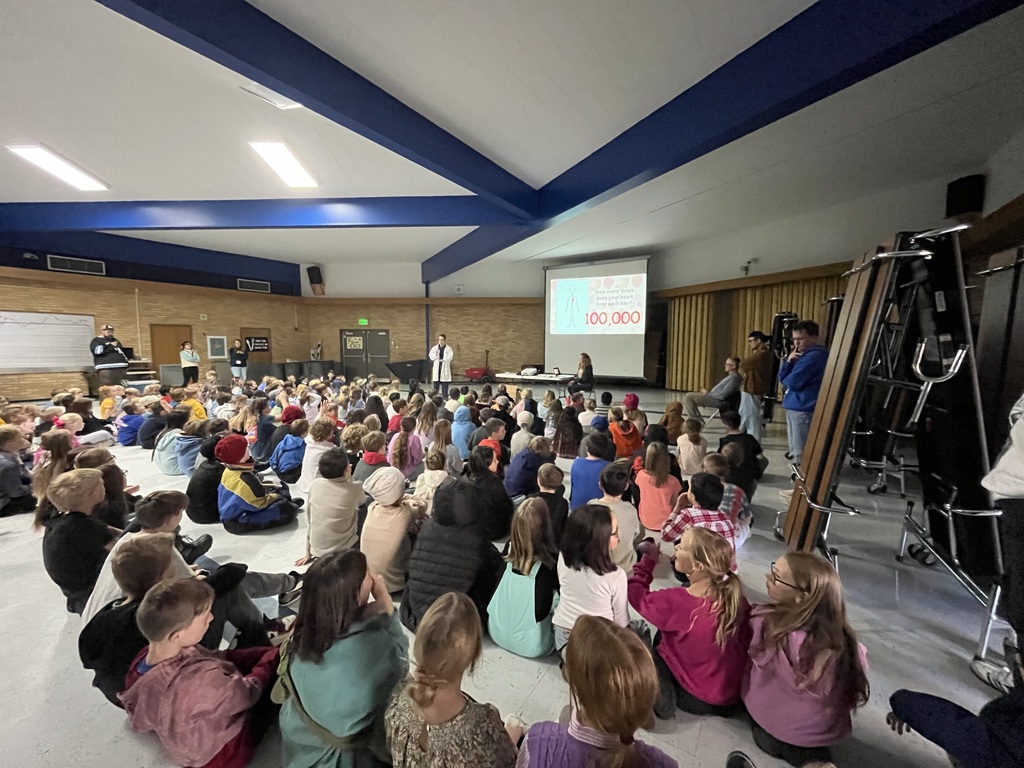 Students of Bates Elementary listening to Dr. McCann speak about his books.