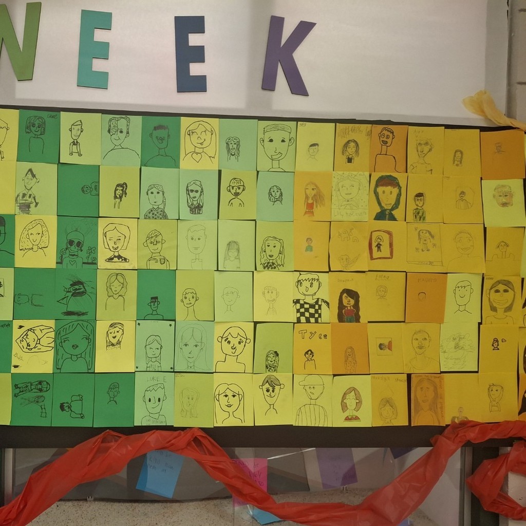 student's self portraits on different colored backgrounds 