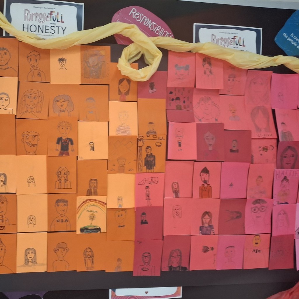 student's self portraits on different colored backgrounds 