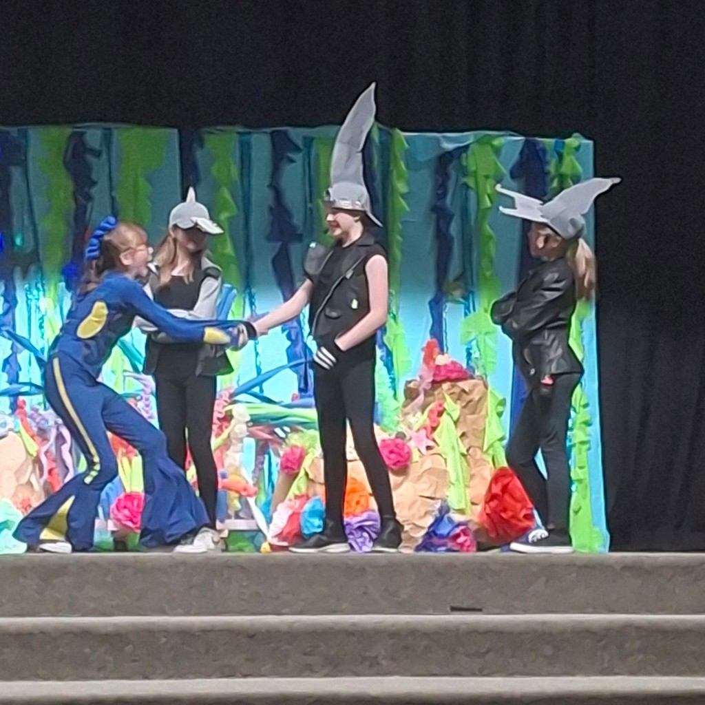 Kids dressed like sharks and dory