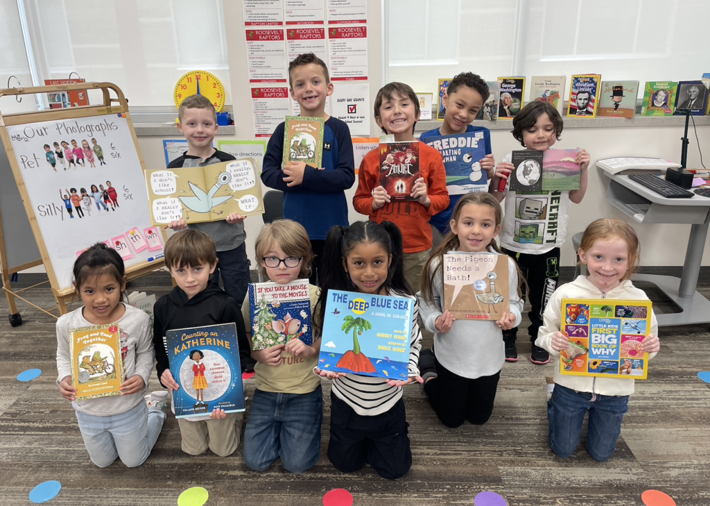 students all holding some of their favorite books