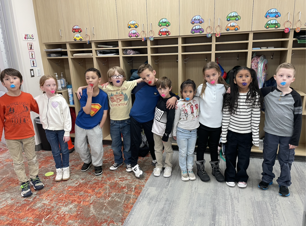 Students with silly lips of all different colors